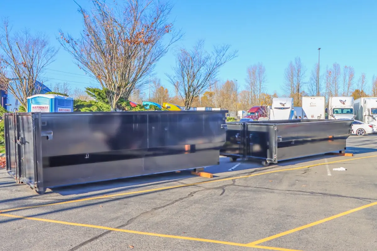 Professional dumpster rental service with roll-off container on residential driveway in Jacksonville